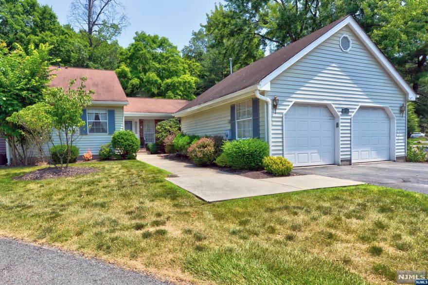 Location, Location, Location! This 2 Bedroom, 2 Bath Ranch style home sits in a prime area of the desirable Manitou community. Just a very short distance to the Community Clubhouse, Pool, & Tennis Courts. Bring your imagination and make this home yours, by placing your personal touches and updates to it. Come into the home & step down into the large sunken Living Rm, with gas fireplace, vaulted ceiling, & sliding glass doors that leads to a large partially covered deck, overlooking your backyard that is surrounded by nature. Both Bedrooms are generous in size. The Primary Bedroom suite includes a Full Bath, with tub & shower, large walk-in closet, a 2nd closet, & make up area with sink. The Formal Dinning Rm was previously used as an office/den. The EIK is large in size & leads to a separate Laundry Rm, then step into the oversized 2 Car Garage which allows for storage and room for a work area. This home is being SOLD AS IS.