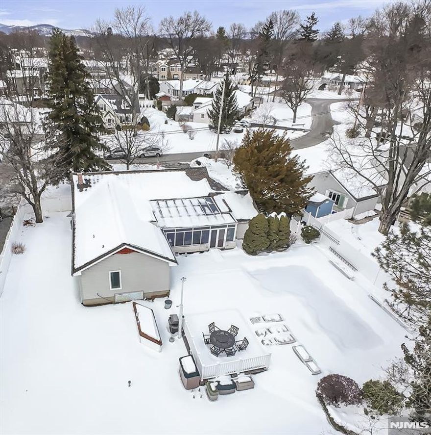 Wonderful Pompton Plains North End location. Need a ranch? Want an inground pool? Here it is. Over 2,200 sq ft. of living on first floor. Sprawling custom ranch set on 94x150 lot with an abundance of natural light. Home features 3 bedrooms, office with built-ins, den, four season room overlooking beautiful fenced yard, gorgeous kitchen with separate eating area, large dining room and walk-out basement. Wood floors, approx. 6 yr new GAF Timberline roof, stainless steel appliances, central air, recessed lighting, skylight, deck, patio. Great location with shopping, restaurants, parks, town lake, golf course, bike/pedestrian path, public transportation and more. Enjoy all that Pequannock Township has to offer! Minutes to major highways. Great school system.