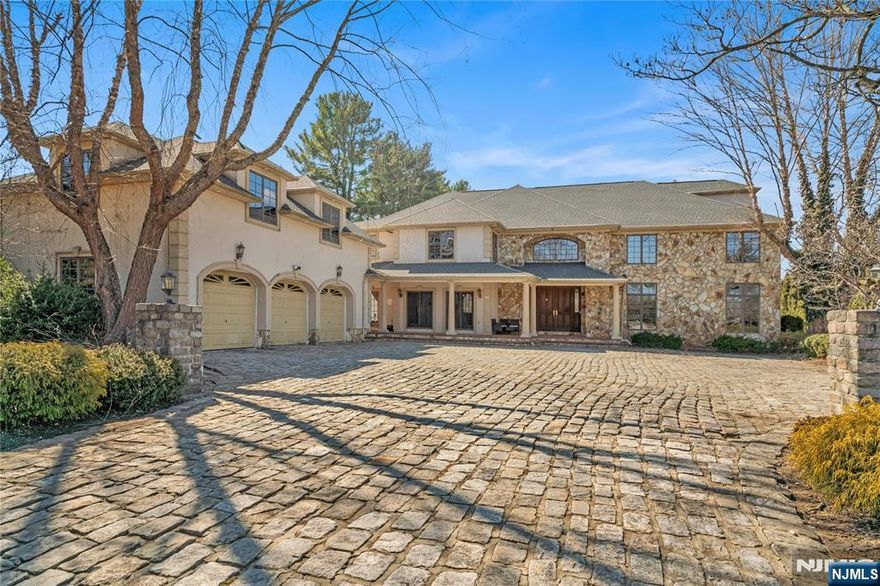 Nestled in the heart of Fairfield, NJ, this 7,000 sq. ft. custom estate is a masterpiece of elegance, comfort, and functionality. The first floor features a grand chef's kitchen with two ovens, two dishwashers, and a spacious walk-in pantry, seamlessly connecting to the living and dining areas, a primary suite with a full bath connected to a game room opening to a backyard oasis with an in-ground heated pool, above-ground jacuzzi, and serene pond. Enjoy three fireplaces, a home office, mudroom, laundry room, and powder room for ultimate convenience. 2nd floor features a luxurious master suite with a spa like layout, 2 walk-in closets, one on a private second level. Across the hall, three bedrooms with 2 full baths, with one featuring a hidden living room. The finished basement offers a wine cellar and gym, while the three-car garage includes a full guest suite above. Set on a huge flat backyard, surrounded by mature plantings.