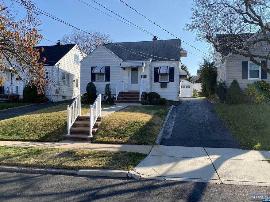 Welcome to this fantastic 3 bedroom 2.5 bath home. It has a detached garage with a long driveway that can fit 3+ cars, a beautiful, landscaped backyard and a large deck perfect for outdoor entertaining. This is a great opportunity for someone to purchase, customize and make it their perfect home. Close to transportation to NYC, shopping, parks and schools. A definite MUST SEE!