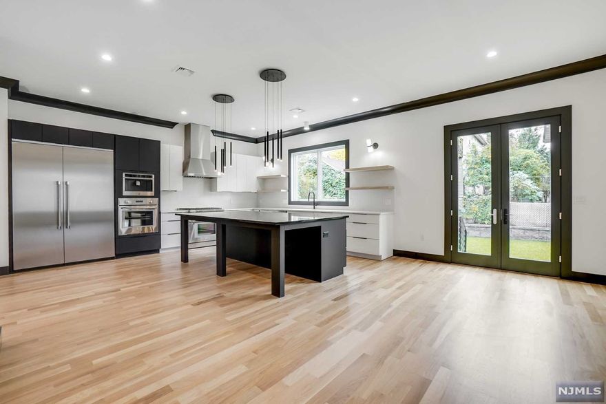 Take a look at this Stunning, Custom built 4,000 Sqft 4 bed home with high quality construction, attention to details and high end finishes abound in this open floor plan. This home comes complete with a Gourmet Kitchen including Quartz and Slate counters/backsplash, high end Thermador appliance package and a built in coffee maker. The Butlers pantry includes a beverage fridge and built in ice maker. This Builder cut NO CORNERS - high efficiency HVAC, White Oak flooring throughout, designer bathrooms, a sumptuous Master Suite, dramatic 10 foot ceilings on the first floor, gas fireplace in the FR, Pella windows, sprinklers, central vacuum, finished ground level rec room, gas line for BBQ and 2x6 exterior wall construction for added efficiency! Prime side street location with easy access to transport and major highways. No expense was spared - this gorgeous home is ready for the most discerning buyer! 3D Tour https://my.matterport.com/show/?title=0&mls=2&brand=0&m=3BS3gXnmZ