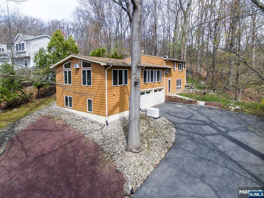 Welcome to this Sensational Custom Home in the Very Sought After Fayson Lakes Community on a Beautiful Large Wooded Lot. Enjoy the Up-Dated Kitchen with a Beamed Ceiling, Gas Range, Modern Backsplash, Stainless Steel Appliances and a Large Peninsula for Seating. The Living Room and Formal Dining Room with HWFLRS Boasting Large Windows for the Light to come Streaming Through. From the Kitchen you will find a large office with Custom Bookshelves. A Primary Bedroom with a Large Walk-In Closet and an Ensuite with a Shower Stall. An additional Bedroom and a Full Bathroom with a Tub/Shower. A Third Bedroom offers an En-Suite with a Shower Stall, also an Exercise Room or a Second Office. A Family Room Featuring a Brick Wood Burning Fireplace, Large Windows and only steps away from the Laundry Room, Powder Room and Utility Room. This House if Great for Flexible Living Options. If the Electric goes out, No Problem, there is a Whole House Generator. Fayson Lakes is a Fabulous Lake Community where New Memories are made. Enjoy Swimming, Boating, Sailing, Fishing, Tennis, Swim Lessons, Swin Races and Fun Activities for Everyone. Kinnelon Offers Top-Rated Schools Year after Year and is close to Shopping, Major Highways, Transportation, Golf Courses, Restaurants, Hiking Trails and Only Approx.35 miles from New York City . Make this your first and only stop!