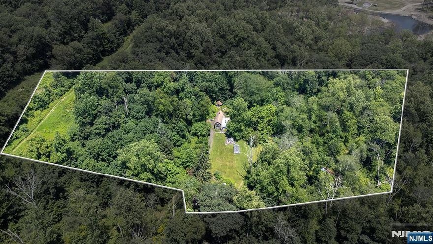 Endless Potential on Just Over 10 Acres & Private Cul-de-Sac Setting! Rare opportunity to own 10 acres of beautiful, wooded land tucked away in the prestigious community of Kinnelon! Whether you're looking to build your dream home or invest in future development, this property offers flexibility, privacy and income potential. Currently improved with a rentable apartment, you'll enjoy steady rental income that can help offset property taxes while you plan your next steps. With generous acreage, thereâ€™s strong potential to subdivide into 2, possibly 3 building lots â€“ or possibly more with a variance â€“ making this an ideal choice for builders, investors, or multigenerational living. All of this is dependent on township approvals. Enjoy peace and seclusion just minutes from local amenities such as a local hospital, a county golf course & TOP RATED SCHOOLS. Create your private retreat, develop, or do both â€“ the possibilities here are limited only by your vision.