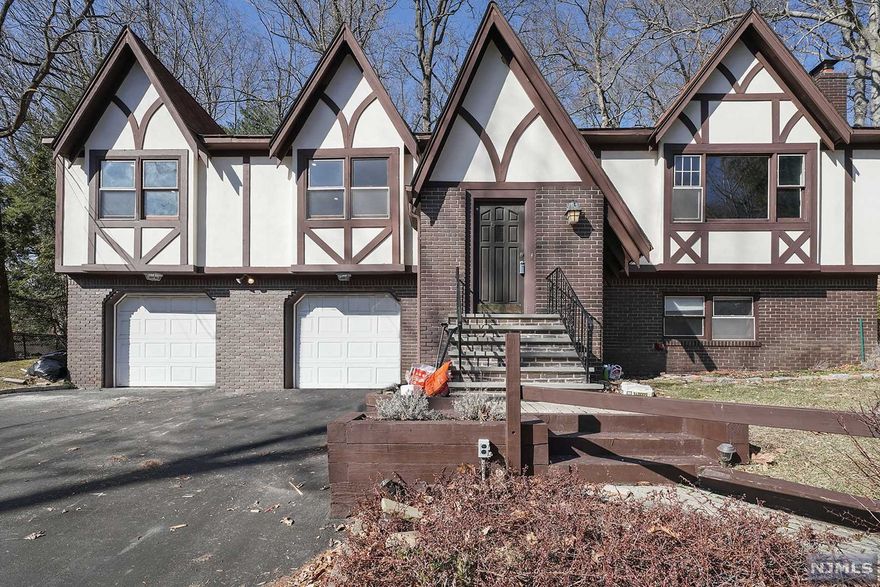 Welcome to this extravagant 4 bedroom 2 and a half bathroom Tutor located in a quiet end of a Cul de Sac in one of Parsippany's most desirable neighborhoods. Walk right into this turnkey property to a recently updated Kitchen with granite countertops and subway backsplash, all beautifully renovated bathrooms, freshly painted interior and wood floors. This home features Cathedral Beam Ceilings, Arch doorways, Skylights, 1 Brick Fireplace and 2 Beautiful Stone Fireplaces, Family Room, Large Basement, Office, Deck and Patio with an attached 2 Car Garage. Close to all major highways and top rated Parsippany school district. This property is must see!