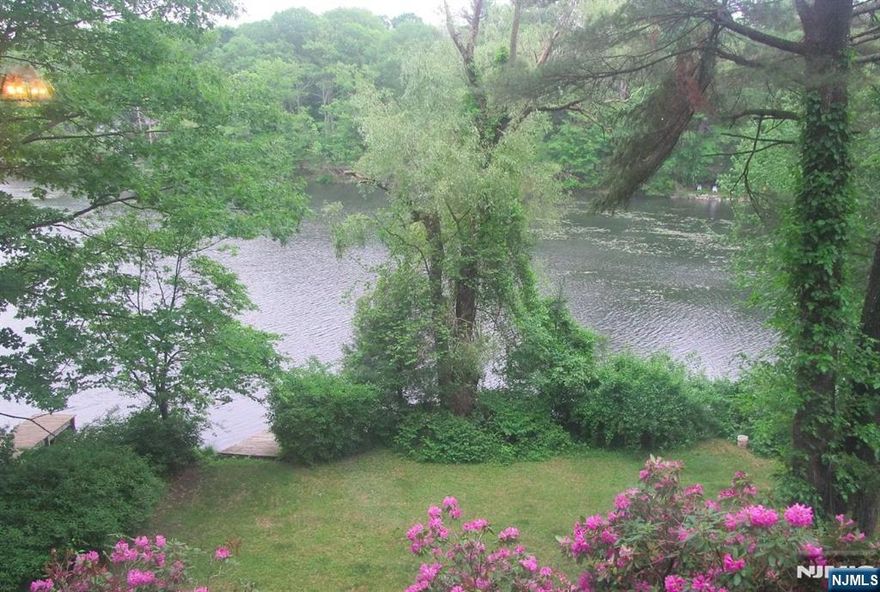 Single-family lakefront home with private access and scenic views.