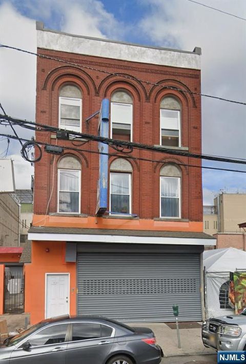 Photo of 351 Grand St, Paterson, NJ 07505 (MLS # 26011390)