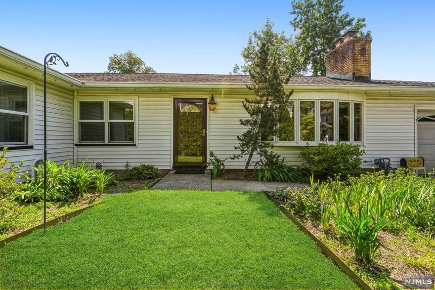 Welcome to this classic ranch, located on one of Nutley's most picturesque streets. This estate has 4 spacious bedrooms and 2.5 baths with a garage. The primary room has lots of closet space and an en suite bath. As for the common area, you have a traditional and functional layout, as you walk in you will find a wood-burning fireplace in the living room and the dining room is located right off the kitchen. Off the kitchen there is backyard access, the laundry room and the entrance to the garage. With hardwood flooring, top of the line Pella windows, and a massive basement- this solid 1960s build has so much to offer, make sure you don't miss out on this gem!