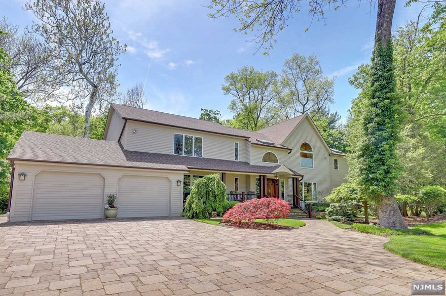 ONE OF A KIND on one of Closter's East Hill cul de sac's.Over 3/4 acre of stunning,flat property!This custom built and immaculately maintained home features a 2 story entry foyer with stunning solid wood moldings and trim,formal dining room,oversized open concept living room/family room,huge kitchen with breakfast area and high end appliances,den/gym with separate access to the primary suite,junior suite with full bath on main level..all with huge windows overlooking the breathtaking private backyard.In the primary suite you'll enjoy 2 walk in closets, large primary bath, balcony overlooking the expansive yard AND 2 separate offices! 3 more bedrooms, full bath and jack and jill bath complete the 2nd level.Huge finished basement w/ summer kitchen,media room,rec room and storage. The MAGICAL backyard is absolutely breathtaking with a huge deck spanning the back, a bridge extending over a babbling brook & mature landscaping.A few blocks from the Closter Plaza and Hillside Elementary.