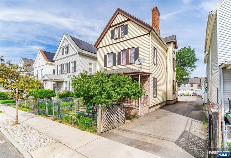 Spacious 3-story home featuring 5 bedrooms and 2 full bathrooms. Bright living areas and hardwood floors throughout provide a comfortable layout with plenty of room. Situated on a deep lot with a large backyard and 6 garage spaces located at the back of the property, offering exceptional parking and storage. Conveniently close to schools, shopping, and transportation. Come turn this house into your home before someone else does!