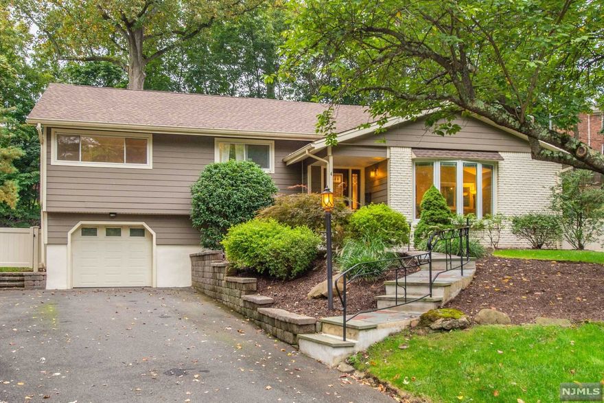 A Prestigious home needs a prestigious location, and this one has it ALL! Everything you've dreamed of & more served on a shiny silver platter in this completely move-in ready, centrally located, elegant dream home. Not only walking distance to tons of restaurants and shops, but steps away from the beautiful, lush Grover Cleveland Park with a private path entrance. Manicured landscaping paves the way and invites you into the expansive first floor with gleaming hardwood floors throughout. Renovated kitchen immediately catches eye with its top of the line stainless steel appliances, custom granite & custom cabinets made for ample storage. Kitchen, dining and living room flow into one another, creating the perfect holiday entertaining space. Ground level getaway allows for more private living area in addition to extra common space upstairs. Spacious master bedroom includes en-suite bath with beautiful tile stall shower. You can truly have it all in the backyard paradise!