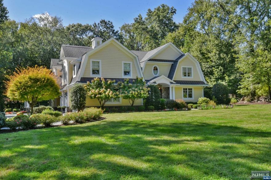 Spectacular Home in Wyckoff w/the utmost attention to detail. This is the home that has it all. Situated in Sicomac on over 1.1 acres, this young home is perfection with an amazing layout, high-end products and workmanship throughout. The grand Foyer w/raised panels and curved staircase sets the stage for this beauty including the banquet sized dining room, luxurious Living Room, custom bar + inviting family room that opens to the Gourmet High-end Kitchen and includes a Pantry and a one-of-a-kind Butler's Pantry. There are 2 half baths and custom mudroom, a back staircase all leading to a fabulous covered carport. 2nd Floor has a deluxe Primary suite w/the gas FPL, Marble bathroom + custom closets, 2 BRs with the J&J Bath, another BR and an additional private guest suite for company. The park-like backyard is lush, flat and private and has a great covered side patio + bkyd patio,too. Full house generator, security, heated garage. Too much to list! Add'l features list available.