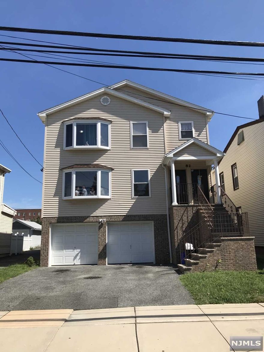 This 9 year young first time to the market..2 family home features 3 bdrms 1 ba LR/DR combo lots of closet space... w/ bonus rooms and 1/2 bath on ground level..2 car garage and plenty of more parking space..