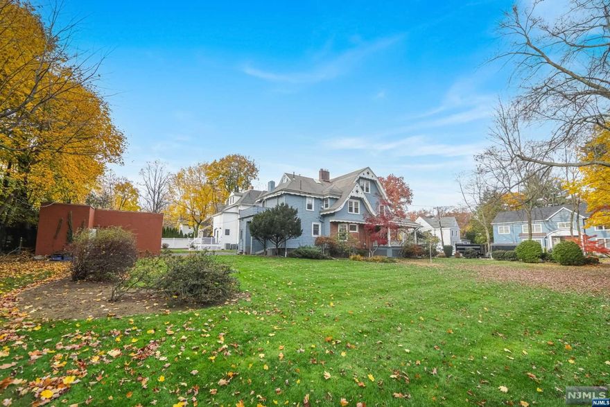 This wonderful updated Victorian offers 6 bedrooms, 3 and a half renovated bathrooms and is set on approximately .4 acres. The spacious foyer features the original millwork, leading into a large formal living/ dining room that shares a double-sided gas fireplace. The kitchen has a wraparound granite countertop with breakfast bar and JennAir appliances. There is also a powder room and mudroom on the main floor.. Upstairs there is a large Primary suite with Porcelanosa renovated bathroom and walk-in closet, four large additional bedrooms, another novated bathroom and laundry. The third floor has a 6th bedroom with a recently renovated en-suite bathroom, and a bonus room perfect for home office or nursery. The basement is unfinished with an additional washer/dryer. There are all new windows,furnace and a two car garage. Wonderful location, close to transportation, houses of worship ,shopping and just 6 miles from NYC.