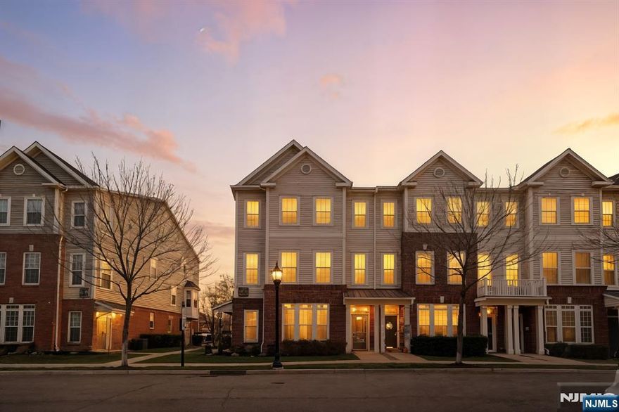 Inquiries - info@restratgroup.com // Welcome to 109 Wesmont Dr, a bright and inviting end-unit townhome in the desirable Wesmont Station community. Built in 2015 by Pulte Homes, this 2-bedroom, 3-bath home offers approximately 1,328 sq. ft. of well-planned living space with excellent natural light. The main level features an open layout with oversized windows, dark hardwood floors, recessed lighting, and a spacious living area that flows into the kitchen. The kitchen includes white cabinetry, granite countertops, stainless steel appliances, a breakfast bar, and a clean tile backsplash-ideal for everyday cooking and entertaining. Upstairs, both bedrooms are generously sized with great sunlight. The primary suite offers a walk-in closet and an en-suite bath with dual sinks, a soaking tub, and a separate shower. An additional full bath and a conveniently located laundry area complete the upper level. Additional highlights include an attached 1-car garage, driveway parking, central air, ample storage, and a well-maintained interior with neutral tones. As an end unit, the home benefits from added privacy and extra windows. Located moments from the Wesmont NJ Transit Station, commuting to NYC is quick and convenient. The community is close to shops, cafés, parks, schools, and major transportation, offering a low-maintenance and highly convenient lifestyle. Move-in ready and ideally situated, 109 Wesmont Dr is a standout opportunity in Wood Ridge.