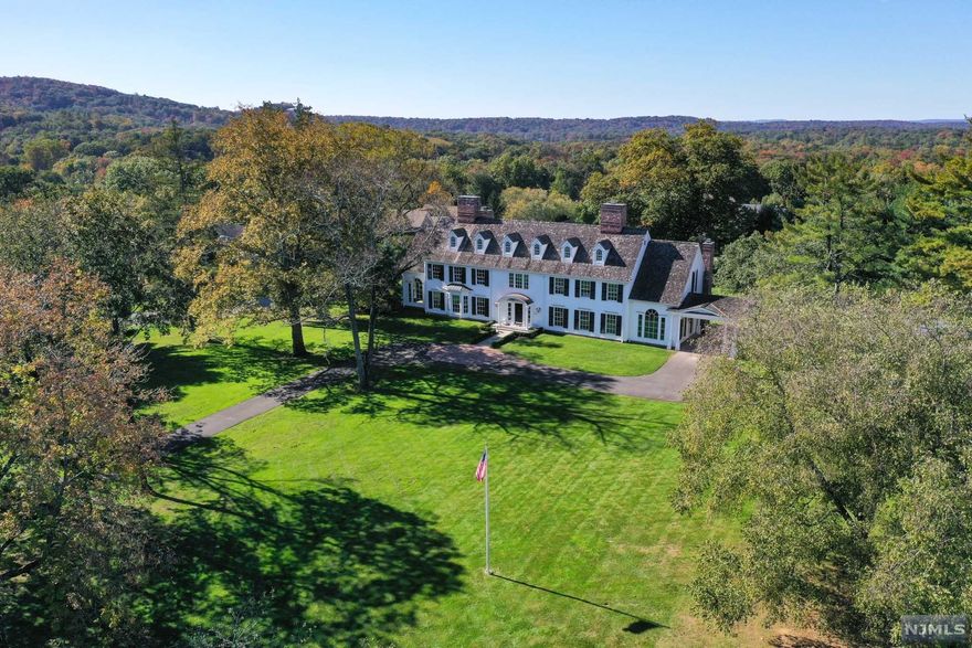 Iconic 10K SF Georgian Col designed & inspired by renowned architect, Stanford White. Offered for the 1st time & set on 4.2 acres of level property, this newly constructed (2006) masterpiece is in the finishing stages of meticulous renovation & remodeling. Sun-drenched, 16-room CHC w grand reception area, formal rooms w soaring ceilings, crown mldgs & cust. finishes. 1st FL boasts lg FLR w FPL, FDR, library & FR leading to enormous new KIT. 1K SF MBR w 2 lg WIC, att sitting rm & new BA. Add'l features of this level-HDWD floors, PR off the EF, newly constructed mudroom & back stairs to 2nd level. 2nd FL has 5 en-suite BDRs w sitting areas & laundry rm. Bonus 3rd level offers space for EXT living, rec, or entertaining. Full unfin BSMT w high ceilings & endless possibilities. Expansive, lush property w terraces, prof. landscaped gardens & built-in pool, cedar shake roof on main house and 2-stry 4-car det. GAR w loft area, 2 1-acre lot subdivision possibilities (approval req)