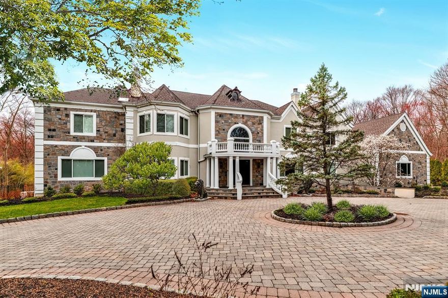 Extraordinary experience in prestigious Saddle River nestled on 2 lush acres. This breathtaking gated estate offers 14,650 sq ft of luxury living across all levels. You'll be captivated by the grand foyer, soaring ceilings & a showstopping great room with a dramatic wall of windows. Refined architectural details throughout. The entire home has been recently renovated with top quality finishes and materials. Expansive layout w. elegant sitting rooms, oversized formal DR, stunning luxury kitchen w. massive center island & custom pantry. Seamless indoor-outdoor flow. Backyard oasis is resort-style living w. a gunite pool & spa, bluestone terraces, outdoor kitchen & professionally landscaped grounds. Ultimate privacy and tranquility. The primary suite is a private wing of indulgence, boasting a home office & spa-inspired bathroom w. sauna. Huge custom WICs enhance the experience. Professional salon & safe room. Amenity-packed basement w. theater, wet bar, gym & bonus rooms ready for customization. 4-car garage, circular driveway, smart home systems. Far too many upgrades to list.