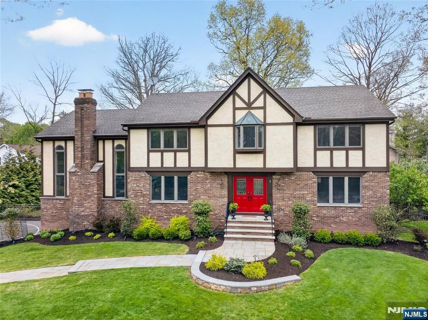 Welcome to this fully updated Colonial set on a cul-de-sac, with nothing to do but move right in. A stunning double-height foyer with beautiful moldings and thoughtful details sets the tone throughout. Spacious living and dining rooms flow into the updated white eat-in kitchen with high-end cabinetry, stainless steel appliances, large center island, and access to a new composite deck overlooking the meticulously landscaped private yard. The kitchen opens to a soaring great room with a gas fireplace, creating the perfect gathering space. A main-floor bedroom and beautifully updated full bath add flexibility. Upstairs, the spacious primary suite features a spa-like bath and walk-in closet, along with 3 additional large bedrooms and an updated hall bath. The lower level offers high ceilings and grade-level access, with a mudroom off the 2-car garage, laundry room, large rec room with gym space, private office, and powder room. Outside, enjoy a private backyard retreat with paver walkways and patios, outdoor lighting, sound system, and gas fire pit. A beautifully finished home in a prime cul-de-sac location. *Correct 2025 Taxes $23,765*. WANT MORE INFO CONTACT LISTING AGENT NICOLE MINETTI @ 201-388 -0077 //nicole@minettidennisgroup.com