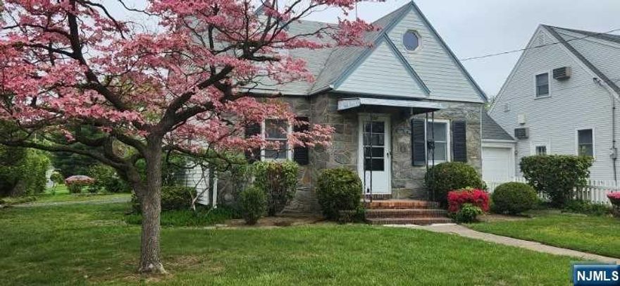 Charm Galore! Custom cape with stone front - great curb appeal! Entry foyer leads to spacious living room and formal dining room, kitchen, 2 bedrooms and bath. Upstairs two tremendous size bedrooms with alcove! Basement with high ceiling is finished with rec room, work room, laundry & storage. Hardwood floors on 1st floor, newer gas heat, one car garage. Low taxes. Terrific location in New Milford's 'Graphic Boulevard' section!