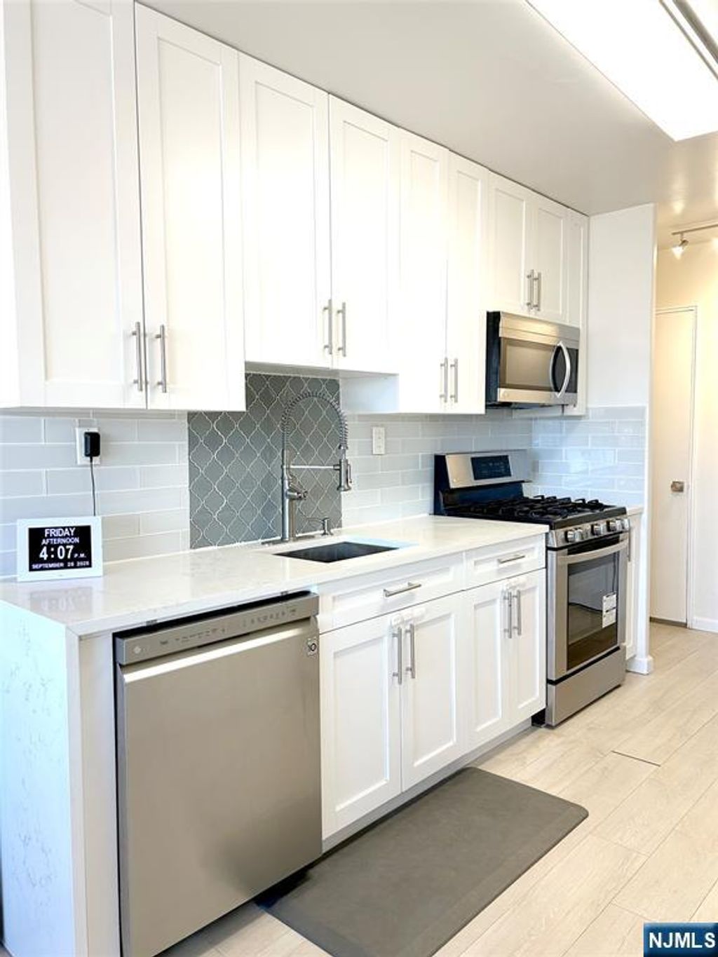 Photo of 2185 Lemoine Avenue #4E, Fort Lee, NJ 07024 (MLS # 25034874)