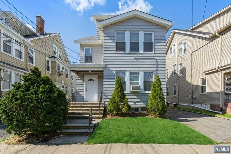 Excellent opportunity for an investor and/or owner occupied with rent as supplemental income. All separate utilities, newer furnace and hot water heater, huge basement for storage, potential hook up for two sets of washers & dryers, front and back staircase, 2 car garage with key pad, & driveway parking for extra cars. The house boasts traditional colonial features such as refinished hardwood floors, high ceilings, moldings throughout, brick faux fireplaces with wood mantles & beautiful leaded stain glass windows. All blended with updated kitchens & baths, replacement thermal windows, abundance of ceiling fans & a fresh coat of paint. Garage to be sold in "as-is" condition. The location is a hidden away oasis that borders Maplecrest Park. Easy access to bus transportation, major highways and local jitney transport to Maplewood train station for NY commute.