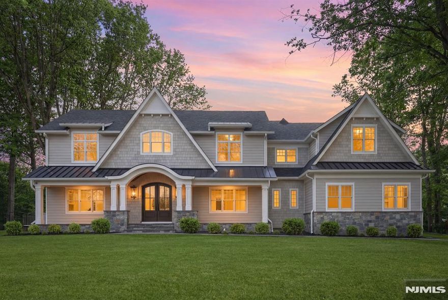 Discover an extraordinary new construction estate in Upper Saddle Riverâ€™s coveted East Hill, designed with a rare sense of warmth and refined luxury. Spanning approximately 8,000 SF across three impeccably finished levels, this residence showcases exceptional craftsmanship, thoughtful design, and effortless modern living. A dramatic 19-foot foyer introduces interiors defined by soaring ceilings, curated millwork, and seamless flow. The main level is anchored by an 11-foot coffered family room and a designer kitchen anchored by a 10-foot quartzite island, bespoke cabinetry, and a full suite of Wolf and Sub-Zero appliances, complemented by a fully equipped prep kitchen. Large sliding doors open to a covered bluestone terrace with a cedar ceiling and statement fireplace, creating a true year-round outdoor retreat. Formal dining, a private office, a first-floor guest suite, and a mudroom with access to a heated three-car garage complete the main level. Upstairs, four en-suite bedrooms include a serene primary suite with vaulted ceilings, dual walk-in closets, and a spa-inspired bath with radiant heated floors, soaking tub, and an oversized shower. A loft offers flexible living space. The lower level with 10-foot ceilings includes a theater, gym, recreation area, and bar. Set on a private 0.87-acre property with pool potential, this home offers a rare blend of comfort, design, and modern luxury in a premier Bergen County setting.