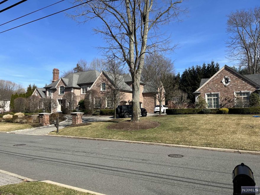 As you step into the grand entry foyer of this all brick colonial home you can't help but notice all the extraordinary details and finishes throughout. This 6 bedroom, 6 full and 2 half bath home has it all. Grand entry foyer, Family Room with fireplace, Living Room, Library with fireplace, Formal Dining Room, Gourmet Kitchen with opening to backyard, Mudroom, Bedroom/Full Bath are all on the main level. The upper level features a Master Bedroom Suite and 3 additional Bedroom and 3 Full Baths. The lower level has a Den with a bar, Gym, Bedroom, Full Bath and Storage. The beautful landscaped grounds feature a heated pool, 2 BBQ areas, cabana with A/C, Full Kitchen, Bathroom and Laundry Room.