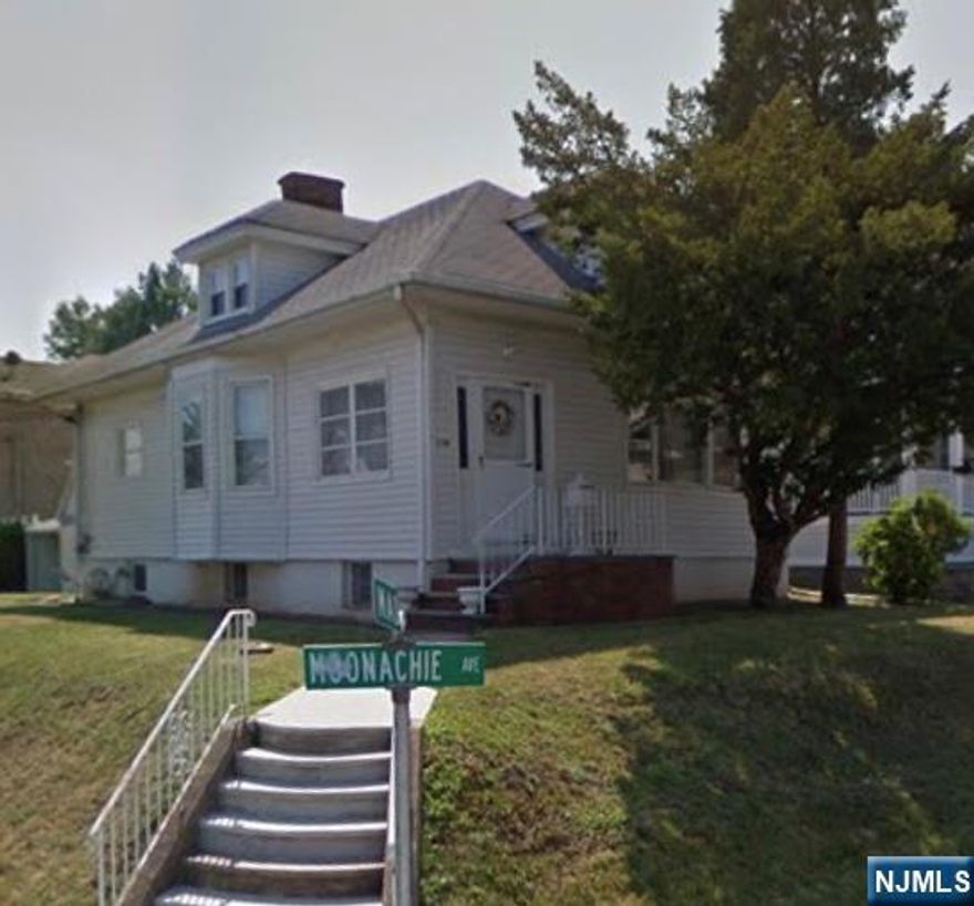 This well-maintained corner Cape conveniently located in the heart of everything. Newer gas furnace. Detached one-car garage. The first floor features a den, living room, dining room, kitchen with a sitting area, full bath, and two bedrooms. The second floor has two bedrooms and a sitting area. The basement has a separate entrance and is currently used as a storage space with a laundry and utility area. It's just minutes from New York City, accessible via highways and public transportation. The neighborhood also boasts shops, schools, and houses of worship.