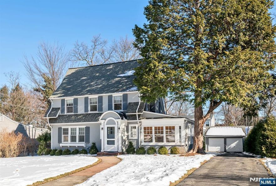 Welcome home to this stunning 1920s Dutch Colonial in the heart of Upper Ridgewood. Featuring a beautiful living room with gas fireplace & built-ins, window-lined family room with French door to the paver patio and generous sized dining room with built-ins, beamed ceilings and butlers pantry. The large kitchen, with tons of storage space, has been updated with new countertops, backsplash and stainless steel appliances and flows into the 3 seasons sun-filled porch to allow for additional living space. Second floor holds a primary bedroom, 2 additional bedrooms, a nursery/office and an updated full bath. Third floor boasts a 4th bedroom with cedar closet along with great storage space. Finished basement with rec room, full updated bath, utilities, laundry and storage. Entertainers dream backyard with large paver patio, built in fire-pit, flat yard for playing and 2 car detached garage. Ideal location, close to Willard, bus & train!