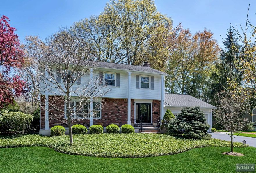 SPACIOUS and well maintained 4 Bedroom, 2 1/2 Bathroom Colonial on approximately HALF ACRE beautifully manicured property in fabulous location! Cozy family room w/marble gas fireplace provides access to the Trex deck perfect for relaxing & grilling. Expanded eat-in kitchen includes breakfast nook with bay window, custom cabinetry and granite counters. Spend holidays entertaining in the bright formal living room & dining room open to each other w/hardwood floors. Large bedrooms including a primary suite; great closet space; mudroom/laundry room off of 2 car garage; generator; security system; and underground sprinklers. Full basement being used as a finished space. Hardwood flooring under bedroom carpeting. AMAZING BACKYARD with tons of room to run and play. PRIME LOCATION in beautiful neighborhood close to town park, playground, NYC transportation, school, shops and restaurants. Harrington Park is a hidden gem with it's award winning schools and close knit community!