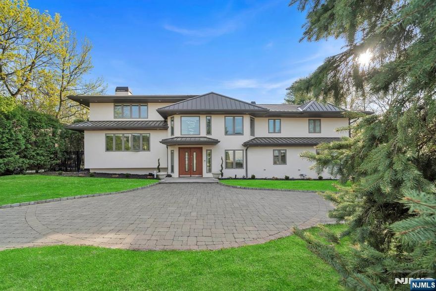 Custom 5BR, 6 full and 2 half bath home offering approx 7,000 sq ft of living space on a private half-acre in the prestigious North Cliffs. Designed for luxury living and entertaining, this property features a resurfaced stucco exterior, architectural standing seam metal roof, paver stone circular driveway, new gutters and leaders, and granite patios surrounding a resurfaced heated Gunite pool with spa, new pool mechanicals, and stone grill area. A dramatic double-height foyer leads to formal living and dining rooms, a conservatory, a lofted flex space, a family room, and a chefâ€™s kitchen with Sub-Zero, Wolf, and Miele appliances, walk-in pantry, large center island, dual wine fridges, and a built-in ice maker. The spa-like primary suite includes dual steam showers, walk-in closets, and sitting area. Three additional steam showers and towel warmers in every full bath continue the spa experience throughout. Additional highlights include a game room, home theater, three gas fireplaces, an oversized two-car garage with finished flooring, Crestron whole-home automation, and a south-facing backyard ideal for outdoor entertaining.