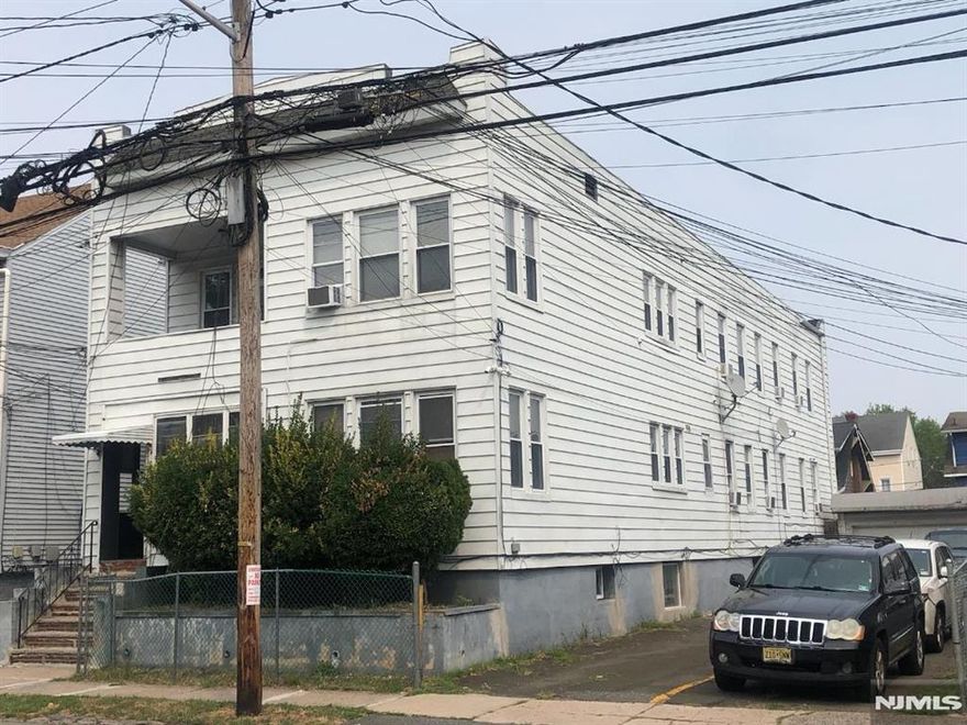 Large 4 family home. Over 5,200 square feet. All good size rooms. All with living room, bedrooms and kitchen and an additional enclosed porch/room or exterior porch. Separate, heat, electric and gas. 2 furnaces and 2 hot water heaters less than a year old. Another furnace 2-3 years old. Extra large utility room and four additional storage rooms in basement. A parking space for each unit. Also a 2 car garage. Close to hospital, shopping and transportation. Easy access to highway,