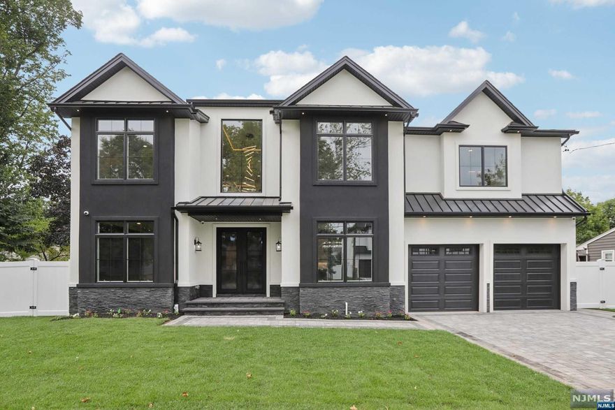 Brand new construction masterpiece on the ultra-desirable East side of Paramus. Modern 2 story entry foyer w/heated floors leading to formal LR & formal DR w/accent walls, & beautiful 6" white oak hardwoods throughout. Butler's pantry leads to dream kitchen w/waterfall island, quartz backsplash, professional appliances, walk-in pantry, breakfast area & wet bar. Stately 2 story family room w/fireplace & custom trimwork. Elegant powder room, bed w/full bath, & mudroom complete 1st fl. 2nd fl features large primary suite w/2 WICs & spa bath w/huge walk-in shower, soaking tub, & heated floors. Jr suite w/full bath, 2 more beds, full bath, & laundry complete 2nd fl. Full finished basement w/home theater, gym, rec room w/wet bar, bed, & full bath. 9 ft ceilings on all floors, security cameras, speakers, central vac, sprinklers, generator, & fenced yard. Paramus is home to amazing schools, LOW TAXES, easy commuting, & great shopping.