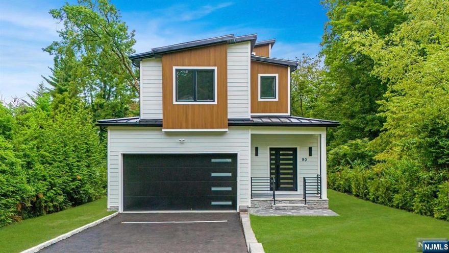 Experience unparalleled luxury in this stunning custom-built 6 bedroom, 5 1/2 bath residence, offering over 5,300 square feet of sun-drenched living space on an expansive property in prestigious Short Hills. Designed with an open-concept floor plan that includes bedrooms on all four floors, this home boasts gleaming blond oak flooring and is ideal for modern living. The main level features a welcoming guest suite, living room, dining room and expansive family room with focal fireplace. The gourmet kitchen is a chef's dream, equipped with top-of-the-line stainless steel appliances, custom cabinetry, quartz countertops and a spacious waterfall edge center island that seats four. On the second level, luxury abounds in the primary suite with a spa-like bath and ample closets. There are also two other bedrooms, a full bath and laundry. The third floor features an expansive loft. The fully finished lower level boasts 9-foot ceilings, rec area and bedroom/full bath.