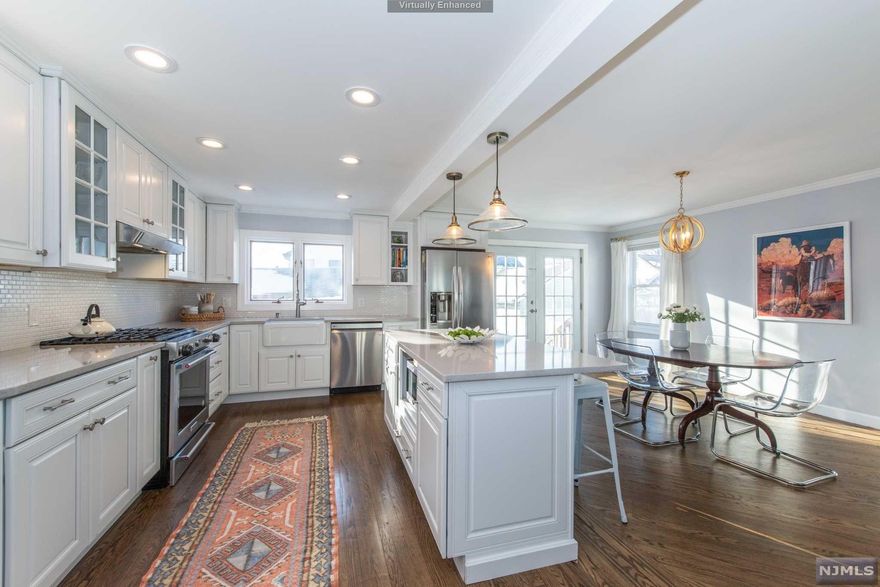 Turnkey perfection! Don't miss this gorgeous 3/4 bed renovated Colonial in the Oakview section w/ approx 2,000 sq ft of usable living space, & zoned for one of the most desirable elementary schools. The fabulous open floor plan lets the sun stream through the spacious LR, Dr & Kitchen, w/ an updated center island, white cabinetry, SS appliances & quartz countertops. French doors lead to the adorable backyard, w/ paver patio, lawn & new landscaping and 2-car garage w/lots of extra space for storage or even for a home gym. The new HVAC system comprises 2 zone CA & forced hot air heating. Beautiful hardwood floors have original ribbon inlay detail. The 2nd flr features 2 lrge bedrooms, + an office (or 4th BR/nursery) & a generous-sized bathroom. An alternative primary bedroom spans the entire 3rd flr & has plenty of closet & storage space. Extra living space is provided by the enclosed 3 season front porch and spacious family room in the basement w/ 2nd bath. Great Commuter Location!