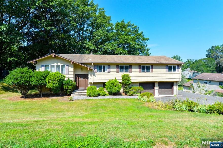 Well maintained 5 bedroom, 3 full bath Bi-Level home in a desirable neighborhood. Ground level features a bedroom, full bath, summer kitchen and living room with sliders leading to a charming 3 season room. Upstairs you will find a bright living room, dining room and eat-in kitchen. Large master bedroom with master bath and a bonus room that can be used as a walk in closet, dressing room or home office. Main bath and 3 bedrooms complete the main floor. The attached 2 car garage and large patio provide ample space for entertaining, storage and outdoor enjoyment. Located near top rated schools, shopping and parks. This home offers both comfort and flexibility in a fantastic community setting. Don't miss the opportunity to make it yours!