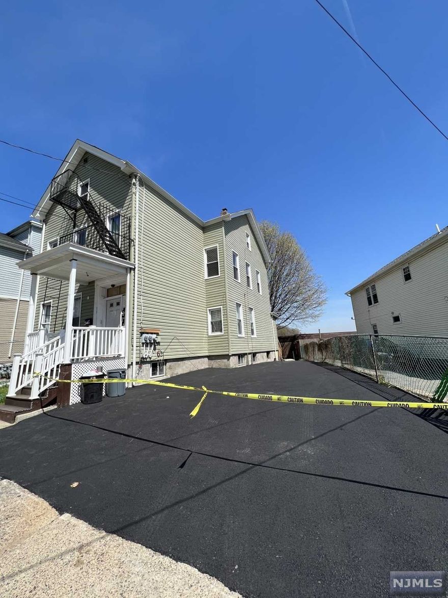 Great investment. Totally renovated, 3 Bedrooms on first and second floor. 3rd floor has 2 bedrooms. All separate utilities. Owner pays 1/2 of the electric for the 3rd floor Large basement can be completed, Brand new drive way fits up to 3 cars