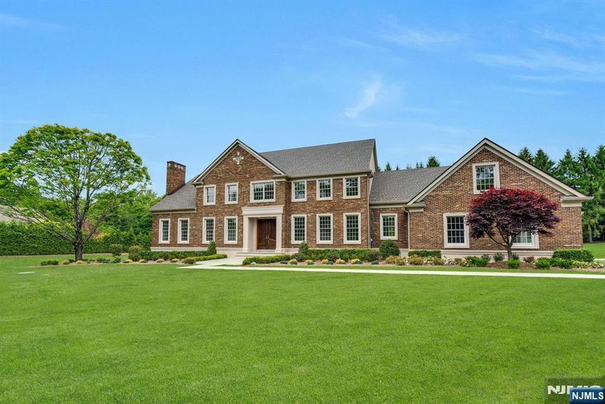 Set on a level two-acre property, this home is an exceptional blend of modern elegance & timeless craftsmanship. The brand-new chef's kitchen boasts a six-burner stainless range, custom cabinetry, sparkling chandeliers, & a spacious island. The butlery features floor-to-ceiling cabinetry with handmade leaded glass & a 50-bottle wine cooler. Gracious living & dining rooms lead to a 2-story great room with fireplace & custom wet bar. A striking library (or bedroom) with en-suite bath adds versatility. All bathrooms feature high-end finishes, & the laundry room is top-of-the-line. The luxurious primary suite offers dual custom closets & a vaulted spa bath. Two more bedrooms, a bonus room, & a third-floor junior suite provide flexible space. BRAND NEW: septic, roof, siding, gutters, irrigation, Belgium block driveway, & more. Convenient location to shopping, dining & easy access to NYC. The expansive property allows room for a future pool & cabana. Ready for occupancy!