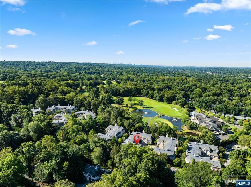 Watch the Video Tour! https://www.njproper.com/mls-311-bellaire Nestled in the desirable Bellaire community of Demarest, this elegant townhouse offers a rare blend of luxury and convenience just 20 minutes from Manhattan. Located in a private 34-unit enclave bordering the prestigious Alpine Country Club, the home welcomes you through a gated entrance into a residence designed with refined detail and modern comfort. The first floor boasts a dramatic two-story entry foyer, a sun-filled living room with a gas fireplace and two sets of French doors opening to a spacious private patio, a formal dining room, a library, and a chefâ€™s kitchen featuring custom cabinetry, granite countertops, Viking appliances, and a breakfast nook. A powder room completes this level, while a three-level elevator ensures effortless access throughout the home. Upstairs, the primary suite impresses with oversized windows, a gas fireplace, a sitting room with wet bar, a spa-like bathroom with radiant heated floors, and a custom-fitted walk-in closet. Two additional bedrooms each feature en-suite bathrooms, complemented by a convenient 2nd level laundry room. The finished lower level offers abundant living space with a playroom, recreation room with fireplace, home theatre, bonus room, full bathroom & powder room. Additional highlights include a private outdoor space, an attached two-car garage, and timeless coffered ceilings, making this residence a true showcase of luxury living in a premier location.
