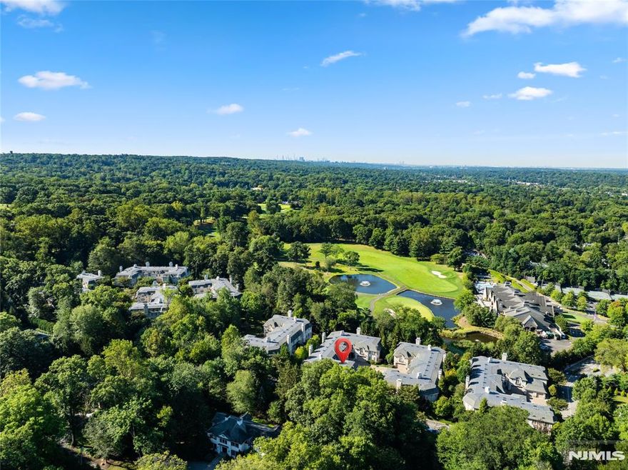 Watch the Video Tour! https://www.njproper.com/mls-311-bellaire Nestled in the desirable Bellaire community of Demarest, this elegant townhouse offers a rare blend of luxury and convenience just 20 minutes from Manhattan. Located in a private 34-unit enclave bordering the prestigious Alpine Country Club, the home welcomes you through a gated entrance into a residence designed with refined detail and modern comfort. The first floor boasts a dramatic two-story entry foyer, a sun-filled living room with a gas fireplace and two sets of French doors opening to a spacious private patio, a formal dining room, a library, and a chefâ€™s kitchen featuring custom cabinetry, granite countertops, Viking appliances, and a breakfast nook. A powder room completes this level, while a three-level elevator ensures effortless access throughout the home. Upstairs, the primary suite impresses with oversized windows, a gas fireplace, a sitting room with wet bar, a spa-like bathroom with radiant heated floors, and a custom-fitted walk-in closet. Two additional bedrooms each feature en-suite bathrooms, complemented by a convenient 2nd level laundry room. The finished lower level offers abundant living space with a playroom, recreation room with fireplace, home theatre, bonus room, full bathroom & powder room. Additional highlights include a private outdoor space, an attached two-car garage, and timeless coffered ceilings, making this residence a true showcase of luxury living in a premier location.