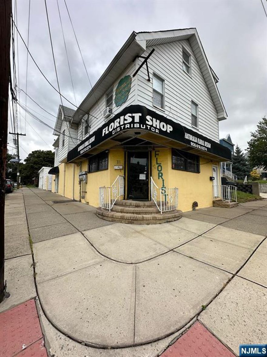 Mixed used building first floor Flower shop operating 9 years, business sold separate. 2 apartments : Second floor Rear: 3 beds one office 2 bathroom is a duplex, central air. Second Fl Front : 3 beds , 2 bath is a duplex. Central air ( no working).