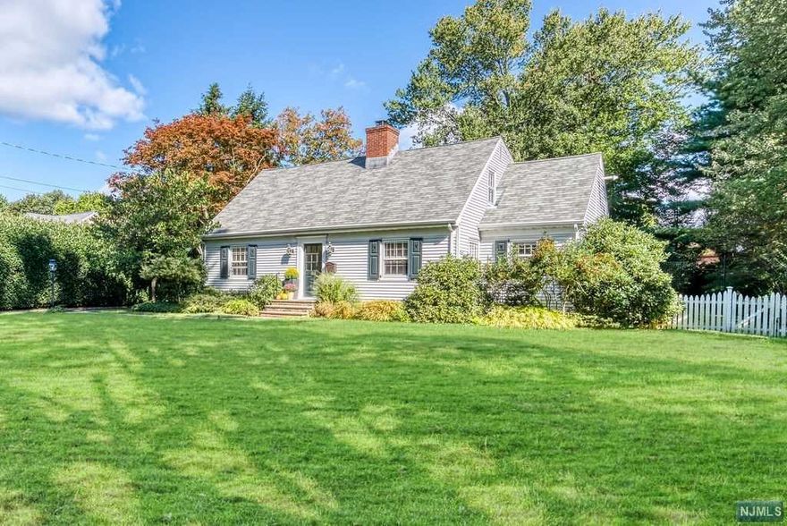 Fall in love with this beautifully maintained jewel of a home tucked in the trees. If location is key, this house offers an abundance of riches with its location .3 mi to the middle and .4 mi to the high school, .7 miles to Mills Reservation (157 acres of trails) and 1.4 miles to Montclair with its many activities, restaurants and cafes. This bright and charming home of over 2200 sq ft (not incl the finished basement) is smartly configured with a complete suite for guests or in laws on the first floor, an eat in kitchen with high end appliances and finishes as well as a spacious living room and dining room. There are 3 more bedrooms on the second floor. The master suite (currently used as an office/den) allows for total flexibility while the main bathroom offers a spa-like experience with a steam shower and radiant floors. The basement is a must see with finished space and tons of storage. Exit the back of the house to a large, parklike yard.Easy access to NYC by bus or train!