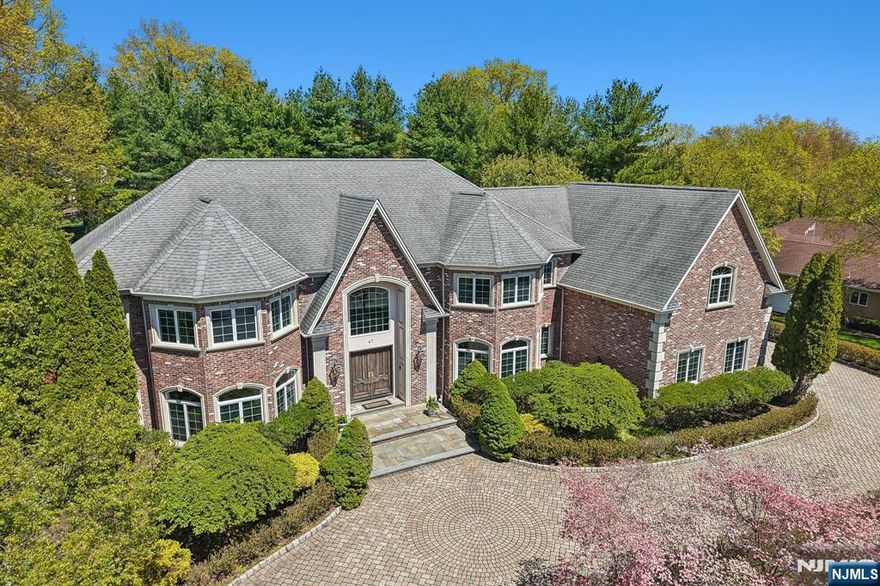 Situated in one of Mahwahâ€™s most desirable neighborhoods, this 6-bedroom, 5.5-bath custom-built estate showcases high-end design, quality finishes, and sits on just shy of an acre of private, oasis-like property. A grand foyer with dual staircases welcomes you into the home, leading to a stunning great room with soaring two-story ceilings. The main level offers formal living and dining rooms, along with a custom-built in office, perfect for working from home. The chefâ€™s kitchen features elegant marble countertops, premium appliances, and a sun-filled breakfast nook ideal for everyday dining. A first-floor bedroom with a full bath provides a perfect setup for guests or extended family. Upstairs, all oversized bedrooms include en-suite bathrooms, while the luxurious primary suite boasts two expansive walk-in closets and a spa-like bath with a steam shower and jacuzzi. The backyard is designed for relaxation and entertaining, complete with an in-ground pool and sauna. Additional highlights include a spacious three-car garage and an unfinished basement ready to be customized. Located in Mahwah, known for low taxes and top-rated schools, this home offers exceptional comfort and convenience.