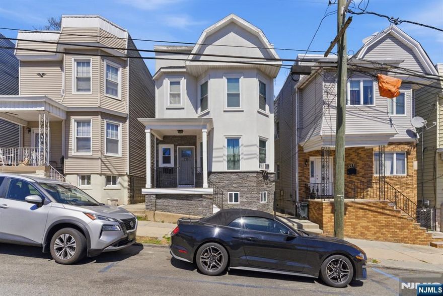 Gorgeous Two-Family Home â€“ Beautifully Renovated in 2018! This two-family property offers modern living with exceptional investment potential and is ideally located near the Harrison border, close to the NJ Transit bus with direct access to the Harrison PATH. Each unit features spacious layouts with 9-foot ceilings and three generously sized bedrooms on both the first and second floors, with the second-floor unit also offering a versatile alcove perfect for a home office or additional living space. The home includes a fully finished high-ceiling basement complete with a recreation room, half bath, utility room, and a convenient laundry area accessible from the first-floor hallway. Everything was replaced during the renovation, including sheet rock, insulation, plumbing, electrical, windows, vinyl siding, stucco, and hardwood flooring. Both units feature newer kitchens with elegant quartz counter tops and beautifully updated ceramic-tiled bathrooms. Additional highlights include two newer gas forced-air heating systems, central air conditioning for both units, two new hot water heaters, and separate, updated electric services. Perfect for investors or owner-occupants!