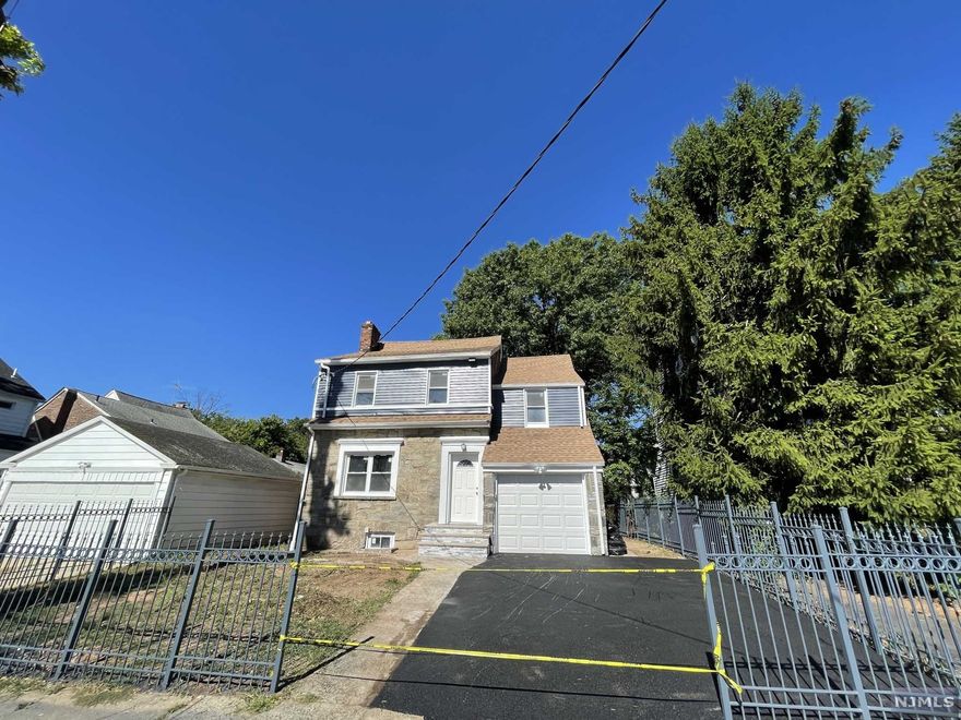 Rare opportunity in Upper Vailsburg Section of Newark, Walking distance from Seton Hall University! Come and see this absolutely gorgeous Contemporary Colonial Features: 4 Large Size Bedrooms & 2 Full Bath with multiple extra Rooms. Huge open concept Kitchen with Shaker Cabinets with Quartz Counter Tops, and a beautiful Kitchen Island with Quarts Countertop Illuminated by beautiful lighting fixtures. High End. Appliances. 2 Central Air Units, and too much to list. Full Finished Basement, with 3 large extra rooms; and a very large Patio.2ND FLOOR FEATURES: 3 LARGE BEDROOMS AND A MODERN BATHROOM. THERE IS A PULLDOWN STAIR LEADING TO ATTIC FOR APPLIANCES AND STORAGE USE. FINISHED LWR LEVEL W/ 3 LARGE SIZE. ROOMS. 2 CAR WIDTH DRIVEWAY, EASY COMMUTE. CLOSE TO TRANS & TOWN. YOUR DREAM HOME AWAITS! Agent Remarks: RARE OPPORTUNITY TO OWN ONE OF THE MOST BEAUTIFUL HOMES & PROPERTIES IN UPPER VAILSBURG SECTION OF NEWARK. GRAND ENTRY W/FIREPLACE, OVERSIZED LIVING ROOM AND SEPARATE DINING