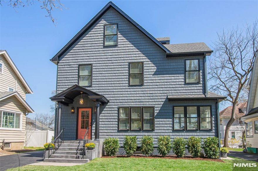 This newly Renovated Contemporary Colonial is set along one of Bloomfield's beautiful tree lined streets, where classic refinement meets modern luxury. A dramatic front entrance with a striking glass door, curated lighting, and expansive windows creates a warm welcome at dusk. The home offers four bedrooms, four full baths, and a first floor powder room. The spacious living room with a two sided fireplace opens to an additional sitting room, while oak hardwood flooring flows throughout. The bespoke kitchen and wet bar feature custom cabinetry, Calacatta quartz countertops, Klien appliances, and a walk in pantry. The primary suite is a sanctuary with a spa inspired bath, a walk in shower for two, rich finishes, a custom closet, and oversized windows framing mesmerizing views. Additional bedrooms are generously sized, filled with natural light, and include custom closets. A serene third floor suite provides an extra bedroom, den, and full bath with treetop vistas. The inviting family room offers custom built ins, a full bath, and a dedicated laundry room. From the kitchen, step onto your private deck and custom patio overlooking an expansive yard with newly planted landscaping and full property irrigation. The home includes efficient two zone heating and cooling for year round comfort. A modern tankless water heater provides endless hot water and energy efficiency. Privacy fencing completes the outdoor space, all moments from NYC transit, great amenities, and beautiful parks.