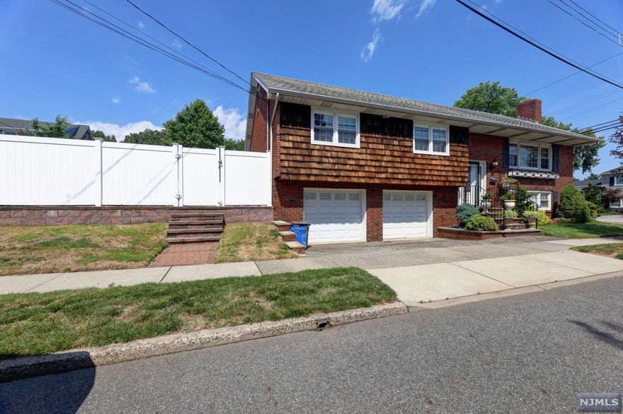 A home is where the heart is! This great Bi-Level home is located on a tree-lined street...Built 1970...Over 2,300 sf...Wonderful curb appeal...Family room with fireplace...Beautiful saltwater In-ground pool and patio...Fully-fenced backyard...Updated furnace & hot water heater (4 Years)...Large kitchen with breakfast area...Hardwood floors...Lower-level updated bathroom...2- car garage. End your search for a home with this one! Minutes from transportation to NYC, steps away from parks and shopping
