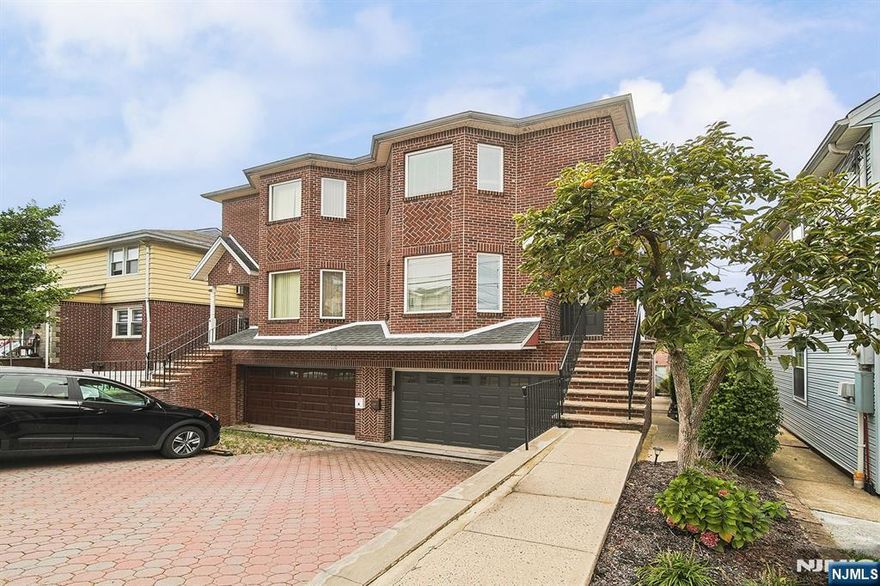 Oversized duplex situated on a prime location of Palisades Park. This all brick exterior duplex features hardwood floor throughout, large eat-in-kitchen w/granite counter top and center island, delightful master bedroom w/jacuzzi tub bath, 2 car garage, and multiple heating zones. There is also a separate entrance on the ground floor for extra convenience. Location is unmatched as it is just steps away from Nyc transportation, local restaurants, local highways and more.