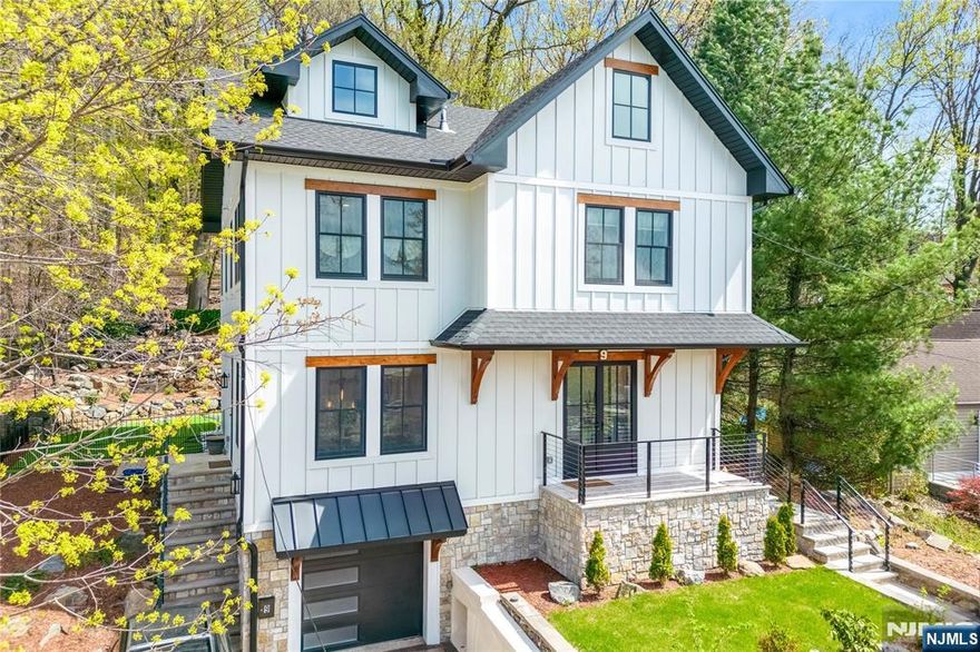 Description adjustment: Welcome to 9 Palmer Place, Leoniaâ€™s premier new construction just 2.5 miles from the GW Bridge. This modern farmhouse offers 4 bedrooms and 3.5 baths with White Oakwood floors, custom millwork, and an open-concept layout ideal for entertaining. The designer kitchen features high-end appliances, a 10-ft island, and flows into the dining and living area with fireplace. Step outside to a private backyard oasis with waterfalls and scenic views of Highwoods Hills Preserve. Upstairs, the luxurious primary suite includes a spa bath, walk-in closet, and balcony. Two additional bedrooms, a full bath, and custom laundry complete the second floor. The finished attic offers space for a loft, office, or gymâ€”with potential for two more bedrooms and a bathroom. A fully finished basement adds a bedroom, bath, rec room, and second laundry. Close to NYC transit, shopping, parks, and top-rated Leonia schools, this home blends modern style with everyday convenience.