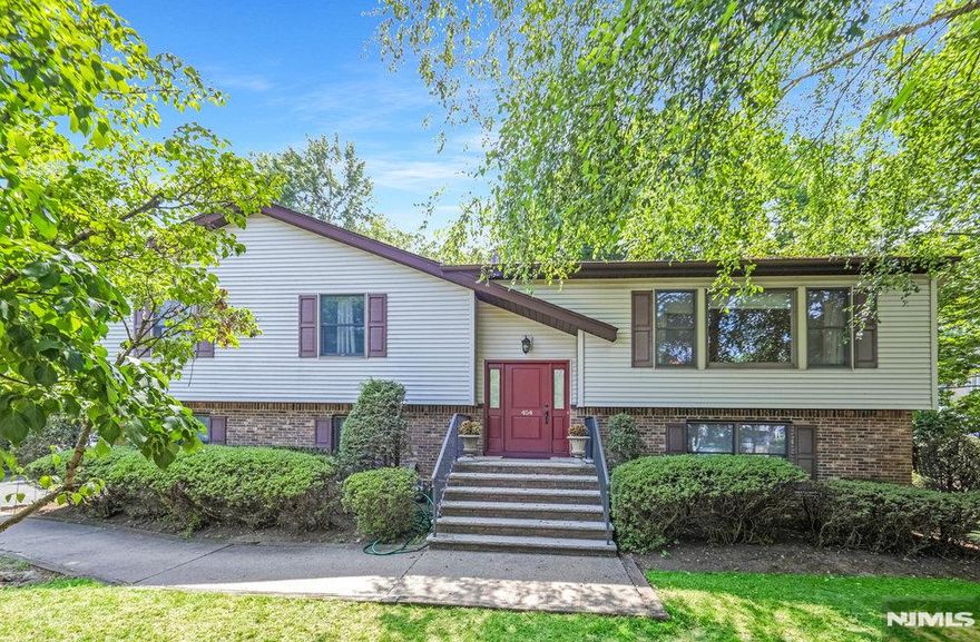 Welcome to this bi-level nestled in the heart of Closter NJ. This generous property boasts a sprawling 2,835 square feet of living space on an expansive 22,216 SQ FT lot. This residence is ready to be your personal retreat. The home features four bedrooms and three full bathrooms offering plenty of space for comfort and privacy. Set up perfect for either first floor living or extended living. The upper level offers 3 bedrooms including a primary bedroom with full bathroom, a 2nd full bathroom, formal living room, formal dining room, and a spacious kitchen with ample counter space. The kitchen provides direct access to a large deck that is ideal for outdoor dining or simply relaxation. The lower level includes a bedroom, full bathroom, family room with fireplace, kitchenette, laundry room, and utility room. Beyond the indoors, the oversized lot provides an excellent setting for entertaining guests or enjoying solitary tranquility. Picture yourself around the fire-pit on a crisp fall evening or hosting summer barbecues on the expansive deck. Hardwood floors run throughout a majority of the house. Central air conditioning. 1-car attached garage. In addition to its many features, this home also offers practicality with a large driveway capable of accommodating at least six vehicles. This ensures convenience for you and your guests. Excellent school system and community events. This home is located minutes from Closterâ€™s vibrant downtown with great shops and restaurants.