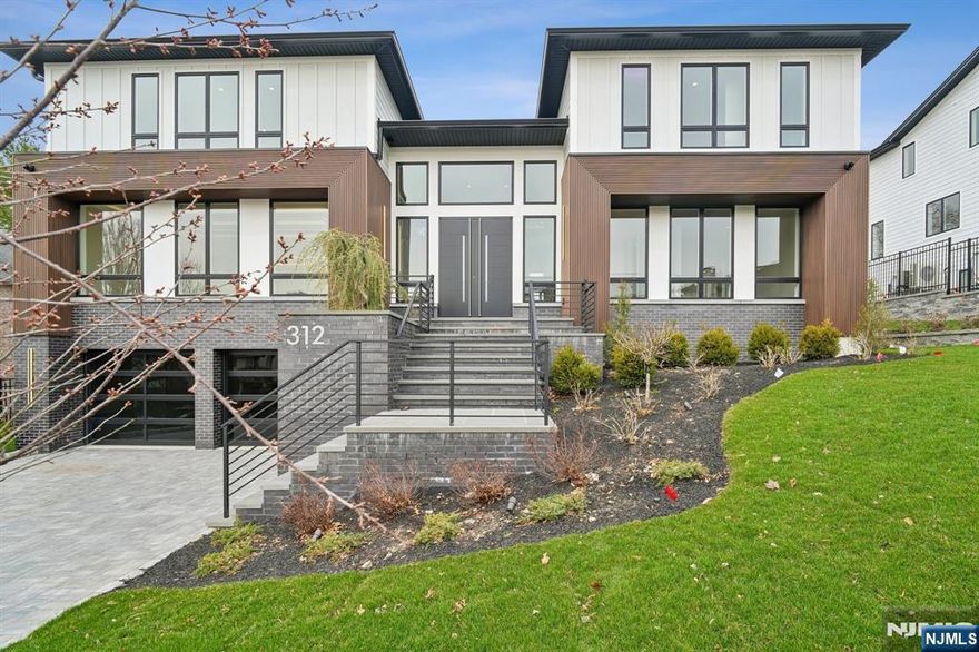 NEW CONSTRUCTION MODERN STYLE. OVER 6500 SQ.FT.OPEN FLOOR PLAN WITH 9FT. CEILINGS ON THE FIRST FLOOR. TWO STORY EF AND FAMILY ROOM WITH DOUBLE SIDED FIREPLACE, LARGE KITCHEN/DINING AREA, WITH QUARTZ ISLAND AND COUNTER TOPS, ALL STAINLESS STEEL APPLS, SUB-0 REFRIGERATOR. ALL BEDROOMS WITH EN SUITE BATH WITH RADIANT HEAT. PRIMARY SUITE WITH LARGE BEDROOM, FIREPLACE, LARGE CLOSETS, AND BATH WITH GLASS STALL SHOWER AND FREE STANDING BATH TUB. FIN BASEMENT WITH REC.ROOM WITH WET BAR, 1 BEDROOM, 1 BATH. OAK FLOORING, CUSTOMING CEILING AND STAIRWAY LIGHTING, PORCELANOSA TILES, SPEAKER SYSTEM,CAMERA SECURITY, C/AC,VAC, 3 CAR GARAGE, LANDSCAPING, GENERAC GENERATOR. SMART HOME FEATURES, CONTEMPORARY DESIGN, DEEP YARD AND A GREAT QUIET LOCATION. PREMIER BUILDER, BUILDING LUXURY HOMES SINCE 1981.